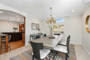 Dining space featuring ornamental molding,