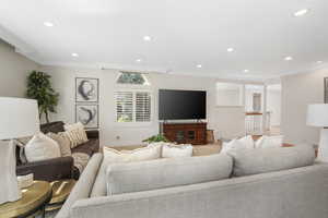 Great room featuring ornamental molding and hardwood