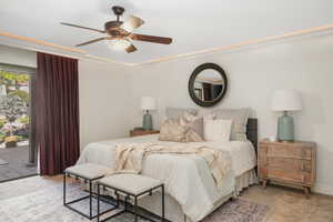 Primary Bedroom with access to outside, ceiling fan, and carpet floors