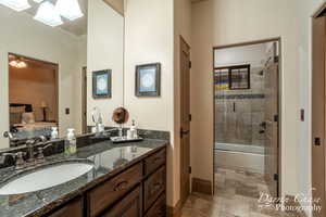 Bedroom 3 ensuite bathroom featuring vanity, tile floors, and tiled shower / bath