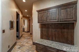 Mudroom featuring light tile flooring