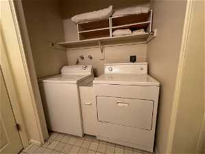 Laundry room featuring washing machine and dryer,  and electric dryer hookup