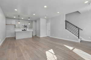 Unfurnished living room featuring light hardwood / wood-style flooring