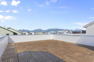 View of patio / terrace featuring a mountain view and a balcony