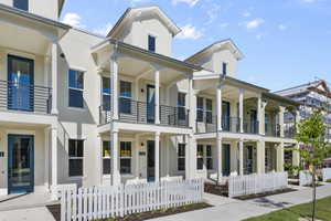 Exterior space with a balcony and covered porch