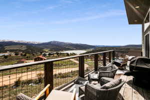 Balcony featuring an outdoor living space and a mountain view