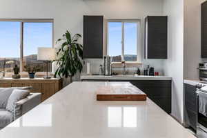 Kitchen featuring sink, a mountain view, and electric range