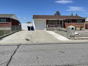 Ranch-style house featuring a garage