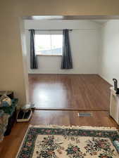 Unfurnished room featuring hardwood / wood-style floors