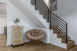 Stairs with hardwood / wood-style flooring