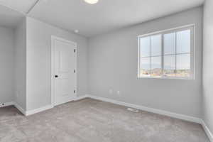 View of carpeted spare room