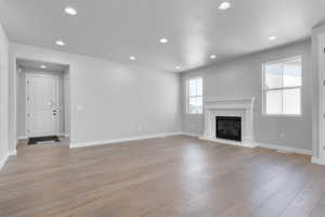 Unfurnished living room with light wood-type flooring