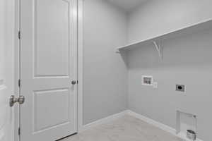 Laundry room featuring light tile patterned floors, electric dryer hookup, and hookup for a washing machine