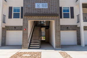 Property entrance featuring a garage