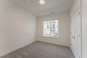 Empty room with carpet floors