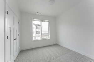 Unfurnished bedroom with carpet