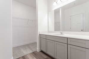 Bathroom featuring vanity and hardwood / wood-style floors