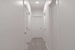 Hallway with light carpet