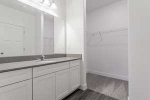 Bathroom featuring vanity and hardwood / wood-style flooring