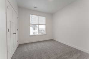 Unfurnished bedroom featuring carpet