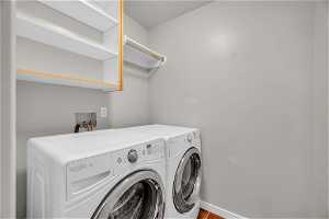 Clothes washing area featuring washer hookup and separate washer and dryer