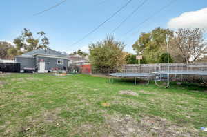 View of yard with a trampoline