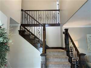 Staircase featuring crown molding