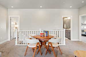 Dining room featuring light colored carpet