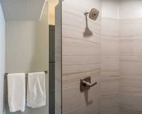 Bathroom featuring a tile shower