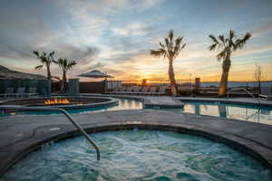 View of pool at dusk