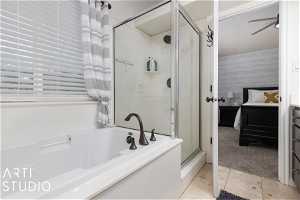 Bathroom featuring plus walk in shower and tile flooring