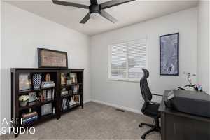 Office space with ceiling fan and carpet flooring
