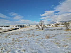 View of yard covered in snow