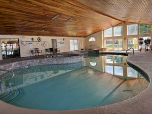 View of pool featuring an indoor hot tub