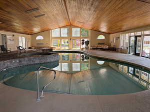 View of indoor pool featuring french doors