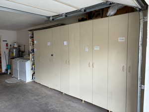 Garage with washer and clothes dryer