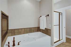 Owners bath with soaker tub and separate shower