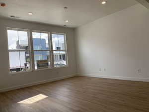 Empty room featuring wood-style floors