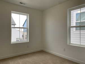 View of carpeted spare room