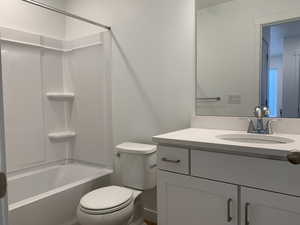 Full bathroom with vanity, toilet, and bathtub / shower combination