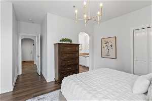 Bedroom 5 featuring dark hardwood / wood-style flooring, a closet, sink, and en suite bathroom
