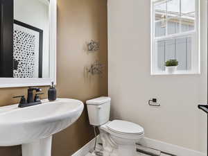 Bathroom featuring sink and toilet