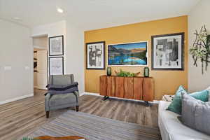 Sitting room with hardwood / wood-style flooring