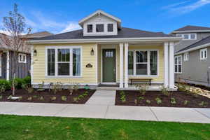 Bungalow featuring covered porch