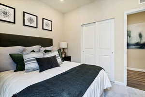 Bedroom featuring a closet and hardwood / wood-style flooring