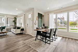 Dining area with hardwood / wood-style flooring