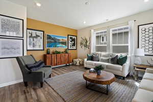 Living room with dark hardwood / wood-style floors