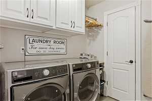 The laundry room is part of the cute mudroom leading into the garage.