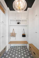 Mudroom featuring light tile flooring