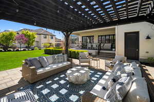 View of terrace with a pergola and an outdoor hangout area